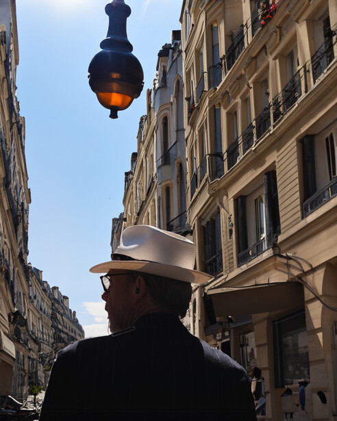 Adobe Generative Fill attempts to replace the background of the previous image of a man wearing a hat
