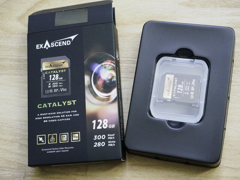 Exascend Catalyst 128GB CFast memory card with retail packaging displayed on light surface.