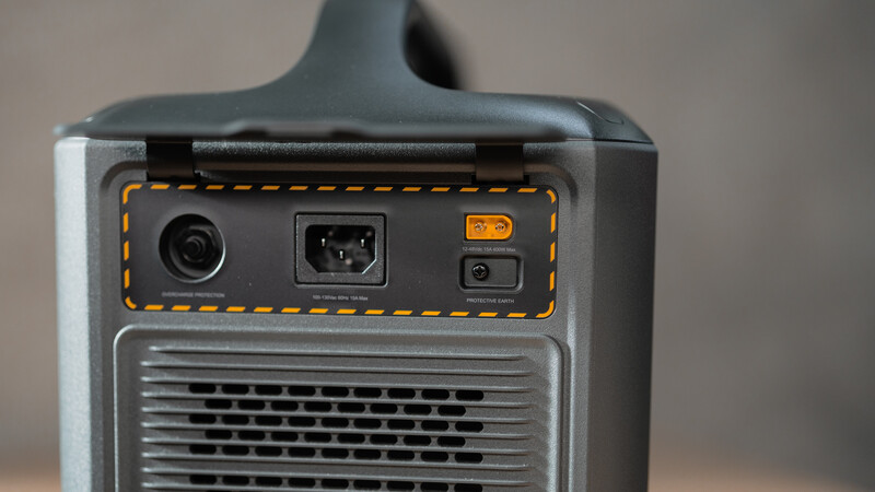 Close-up of a professional lighting equipment's rear panel showing power input, USB connection, and control buttons.