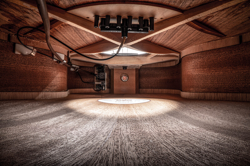 Interior of a professional acoustic studio with wooden ceiling and brick walls