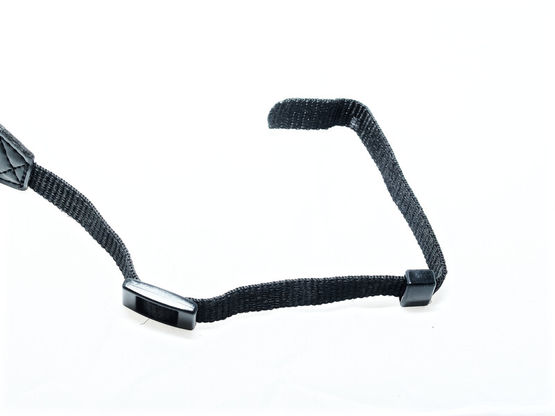 Black camera strap with metal connectors and ribbed nylon webbing against white background.