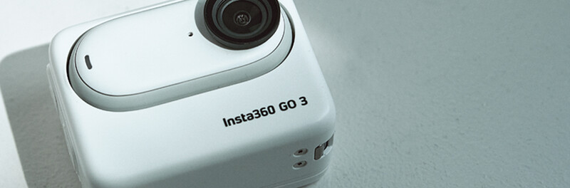 Insta360 GO 3 compact action camera in white, shot from above against a neutral gray background.