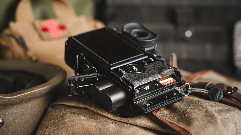 Fujifilm X-T5 with the card slots and battery door open
