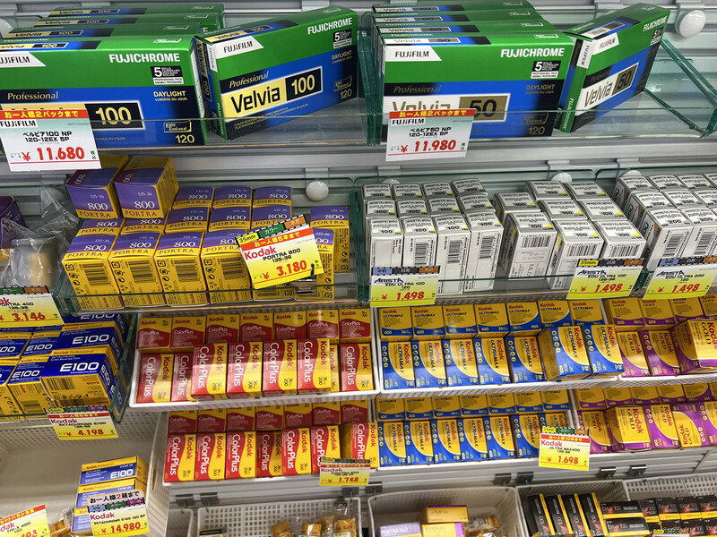 Shelves of packaged food products with yellow price tags in a grocery store display.