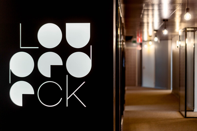 Logo for Luo Orock, a modern geometric design featuring white circles and curved shapes on black background.