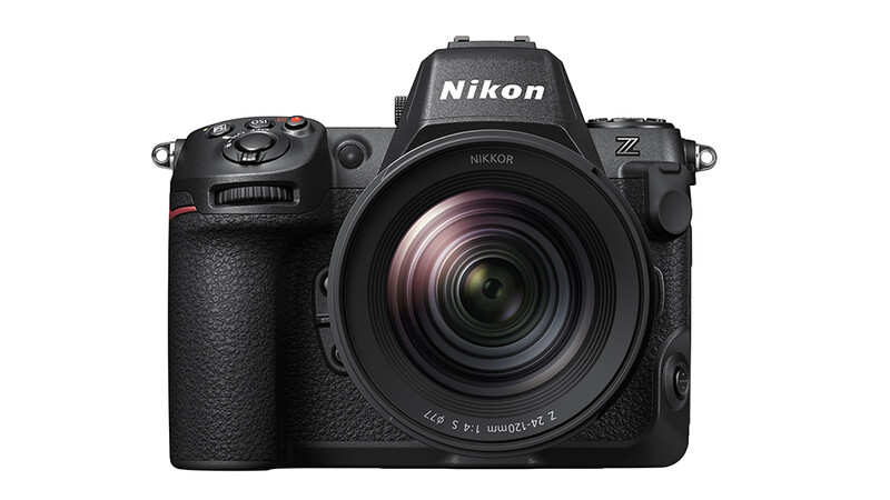 Nikon Z mirrorless camera with standard zoom lens attached, shown in front view against white background.