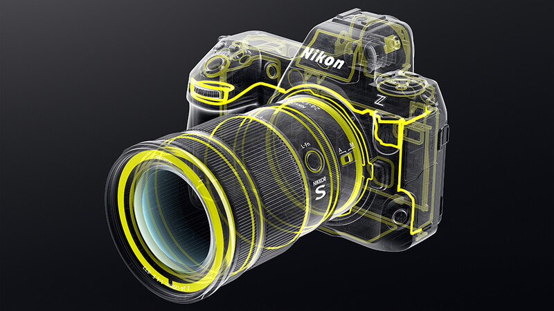 Cutaway illustration of Nikon Z mirrorless camera and lens with yellow accent lines showing internal components.