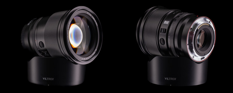 Two Viltrox camera lenses mounted on black cylindrical bases, shown side by side against a black background.