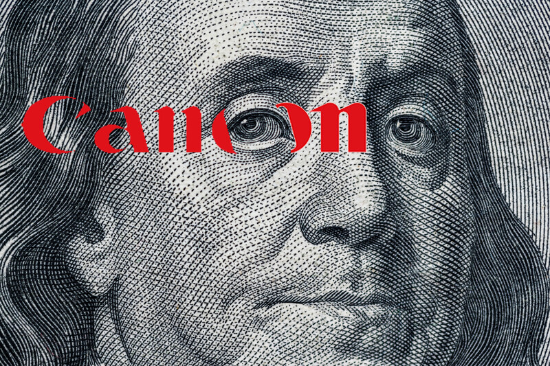 Engraved portrait with red Canon logo overlaid across the eyes.