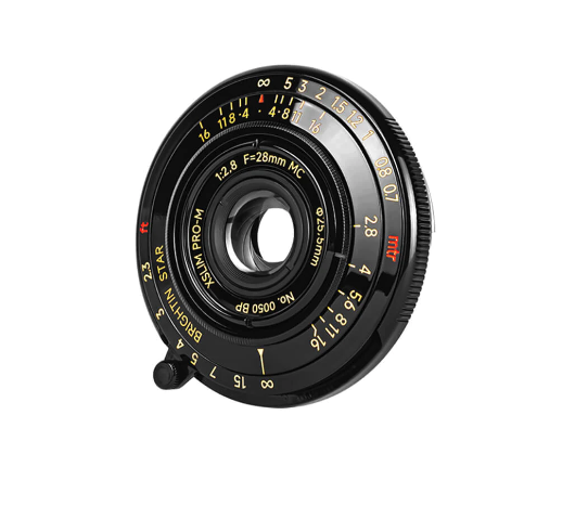 Vintage manual camera lens with aperture ring and depth-of-field markings visible.
