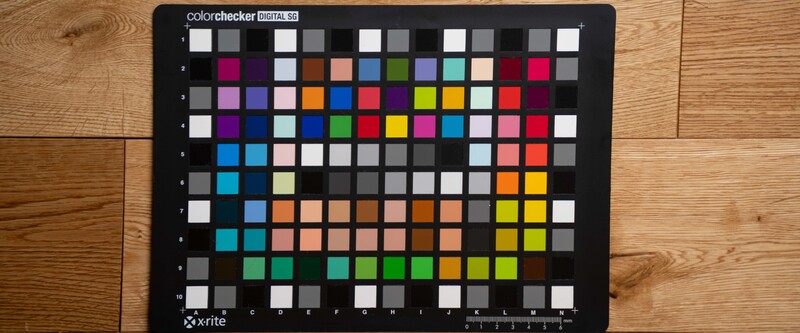 X-Rite ColorChecker Digital SG color reference chart on wooden surface.
