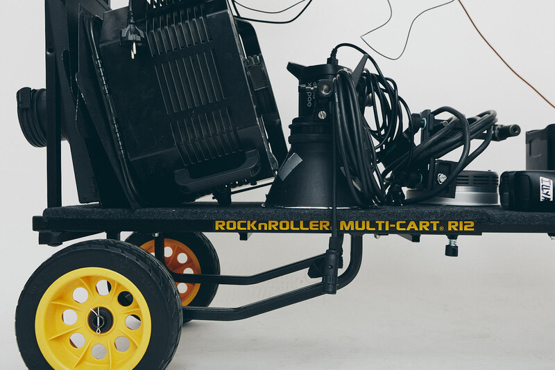 RockRoller Multi-Cart Rig equipment cart with yellow wheels and black frame on white background.