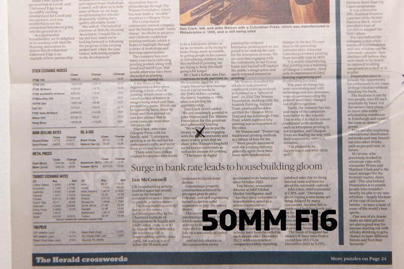 Newspaper page featuring article headline "Surge in bank rate leads to housebuilding gloom" with multiple columns of text and data tables.