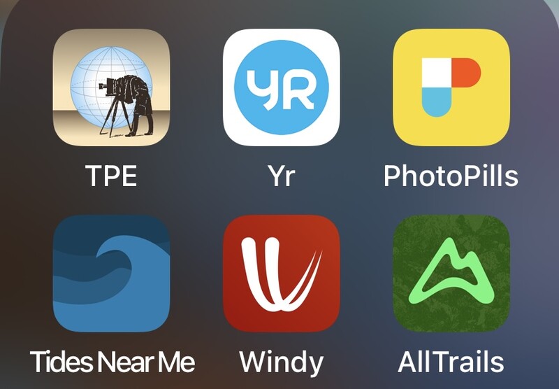 Screenshot showing six mobile app icons arranged in a grid: TPE, Yr, PhotoPills, Tides Near Me, Windy, and AllTrails.