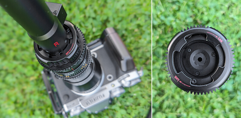 Vintage cinema lens mounted on film camera body with focus ring and depth-of-field markings visible.