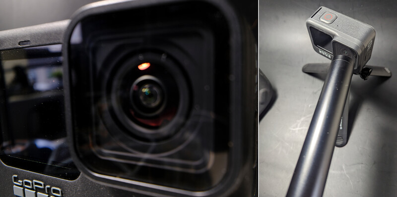 Close-up of a GoPro camera lens and a handheld gimbal stabilizer mounted on an extension pole.