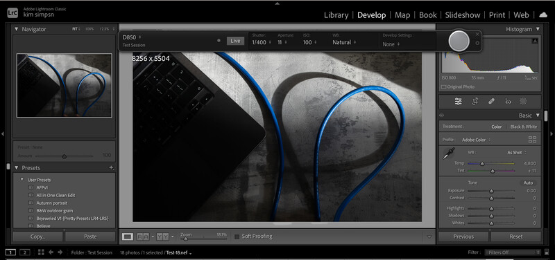 Screenshot of Lightroom's Develop module showing a black and white photo of blue cables on industrial pipes.