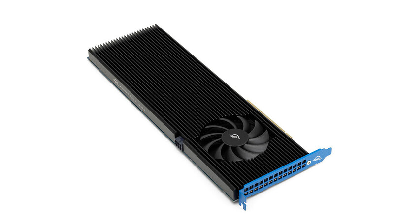 High-end graphics processing unit with extensive aluminum heatsink fins and central cooling fan against white background.