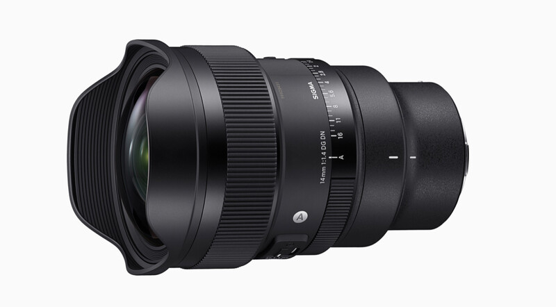 Wide-angle camera lens with manual focus ring and depth-of-field markings against white background.