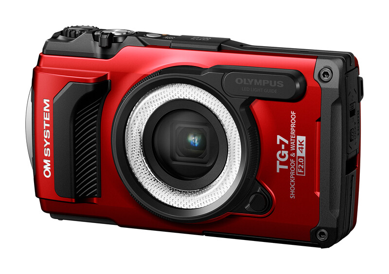 Olympus TG-7 rugged compact camera in red and black, front three-quarter view against white background.