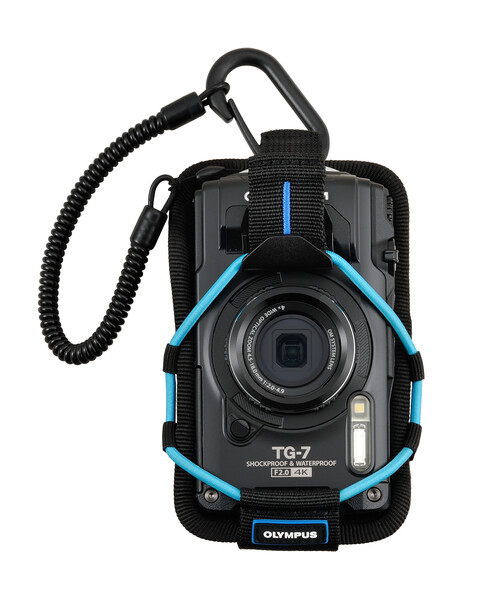 Olympus TG-7 rugged compact camera with blue accents and attached carabiner lanyard.