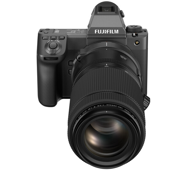 Fujifilm medium format mirrorless camera with telephoto lens attached, shown from front-facing angle.
