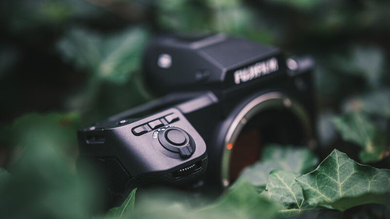 Three fully programmable buttons right behind the shutter release.