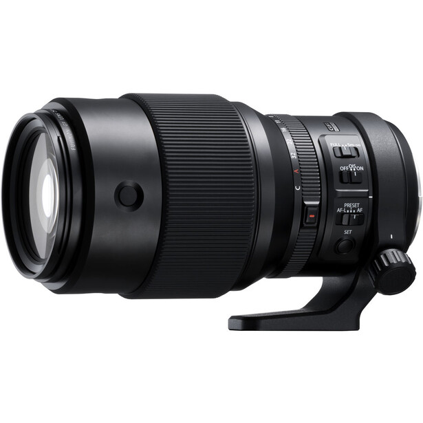 Black telephoto lens with focus ring and control switches mounted on white background.