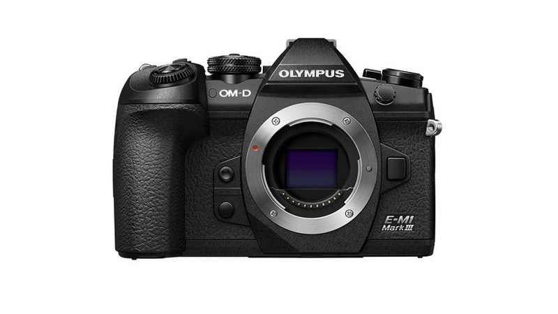 Olympus OM-D E-M1 Mark III mirrorless camera body, front view with lens mount visible.