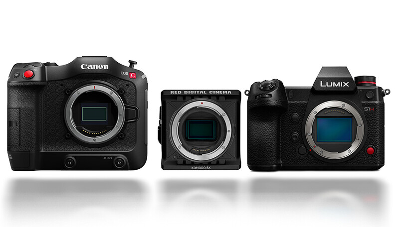Three professional digital cameras displayed side by side showing their sensor housings and body designs.
