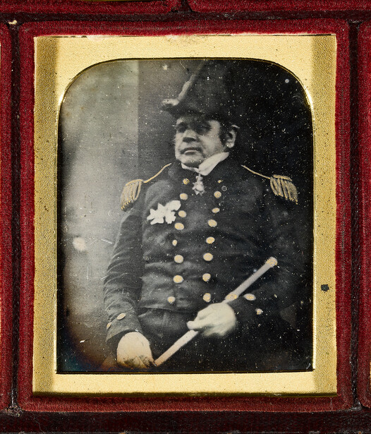 Hand-tinted daguerreotype portrait of a military officer in formal uniform with medals and epaulettes.