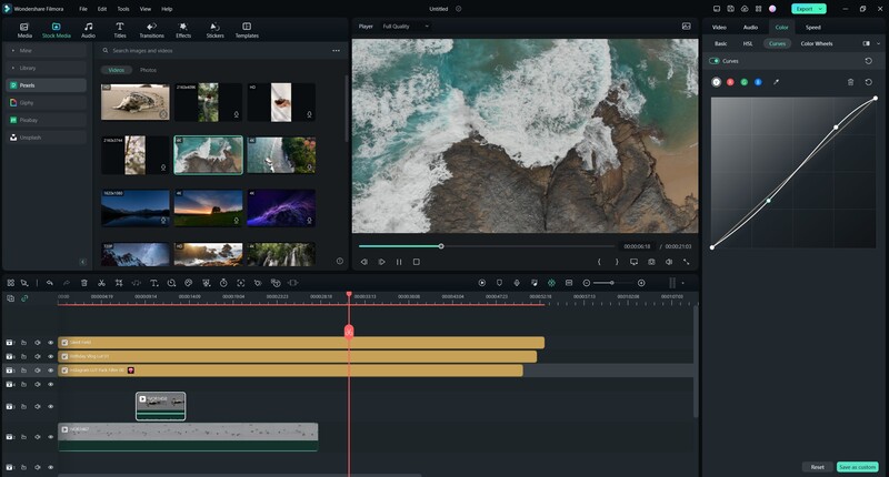 Screenshot of video editing software showing aerial coastal footage with timeline and color correction tools.