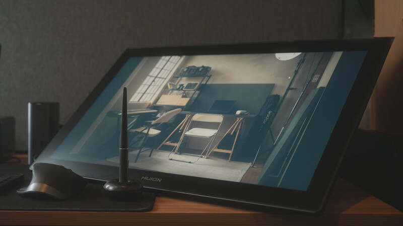 Digital tablet displaying a 3D architectural rendering of an interior space with furniture and natural lighting.