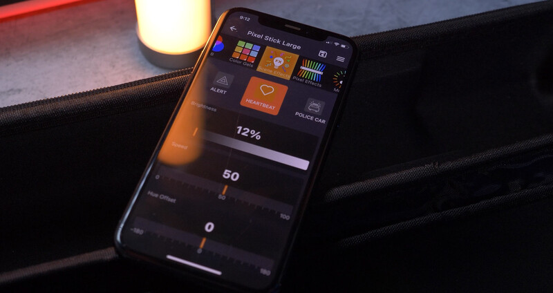 Screenshot of a mobile app interface for lighting control with sliders and preset buttons displayed on a smartphone screen.