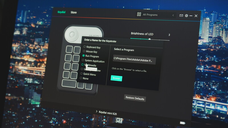 Screenshot of keyboard customization software showing programmable key assignments and LED brightness controls.