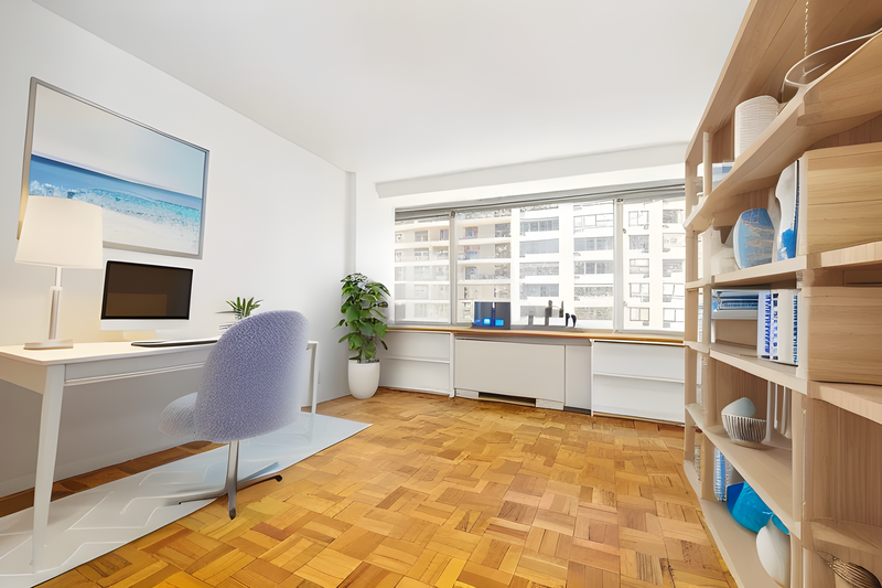 Modern home office with wooden shelving, white desk, and city view through large windows.