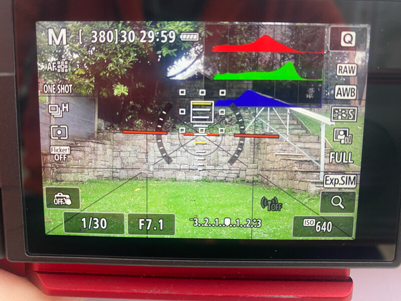 Screenshot of drone camera interface showing aerial video feed with focus peaking and exposure controls.