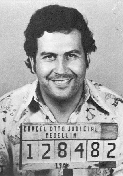 Black and white mugshot photograph with identification placard showing numerical prisoner record.