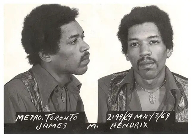 Mugshot-style portrait showing profile and front views of a man with distinctive facial hair and 1970s styling.