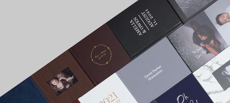 Arranged collection of premium book covers and packaging with varied typography, colors, and photographic elements.