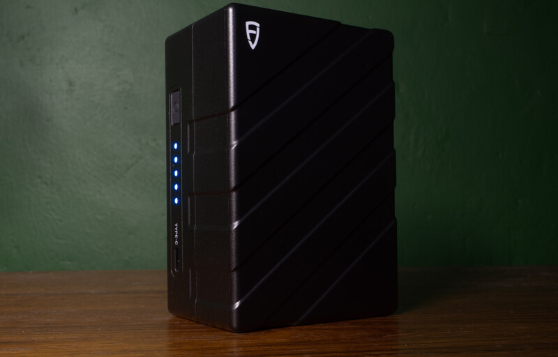 Black gaming PC tower with illuminated blue power buttons on the left side panel.