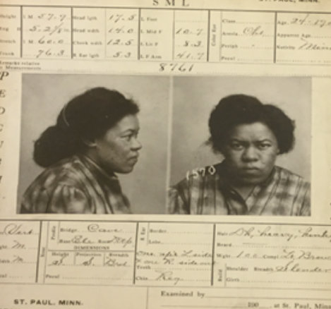 Vintage mugshot-style photograph showing profile and frontal views of a subject with identification paperwork.