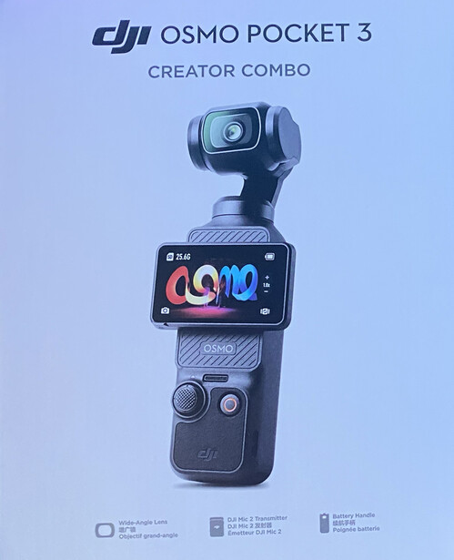 DJI Osmo Pocket 3 Creator Combo gimbal camera with touchscreen display and control handles against light blue background.