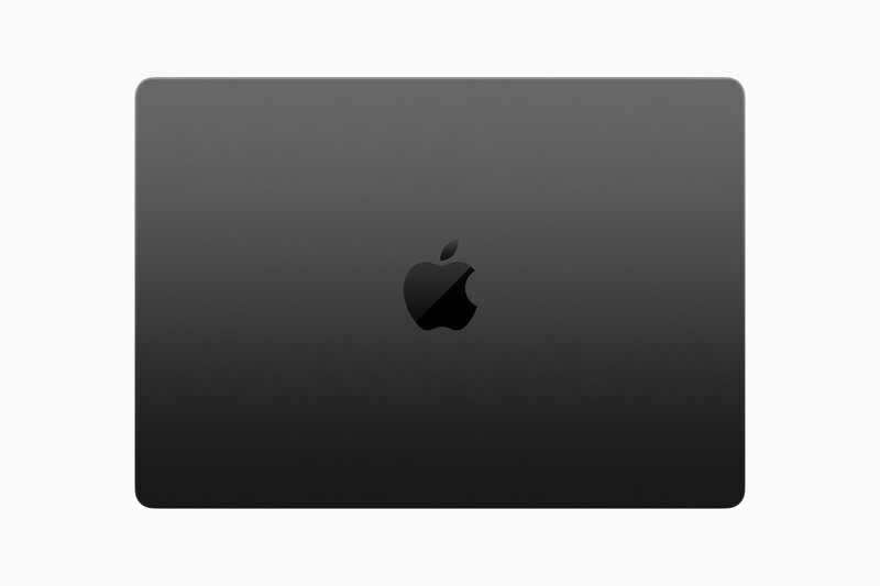 Closed MacBook with Apple logo centered on dark aluminum lid.