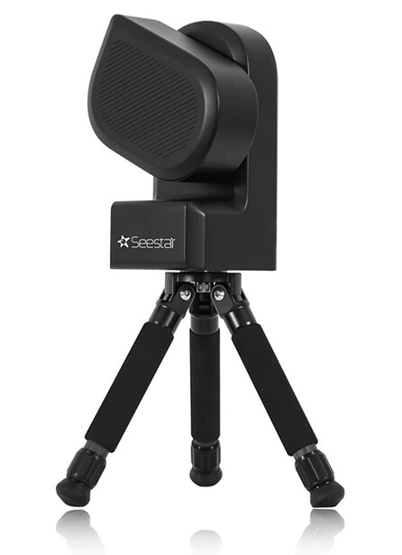 Professional camera trap mounted on compact tripod with articulating head and textured lens housing.