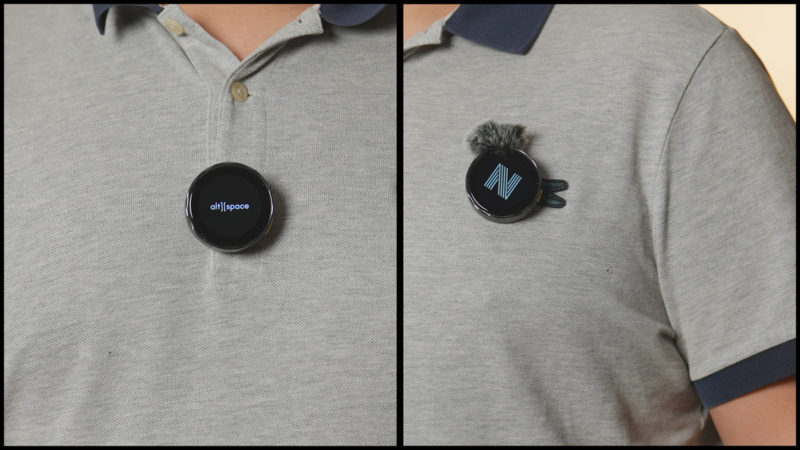 Two views of a circular black device clipped to a gray polo shirt, showing front and back displays.