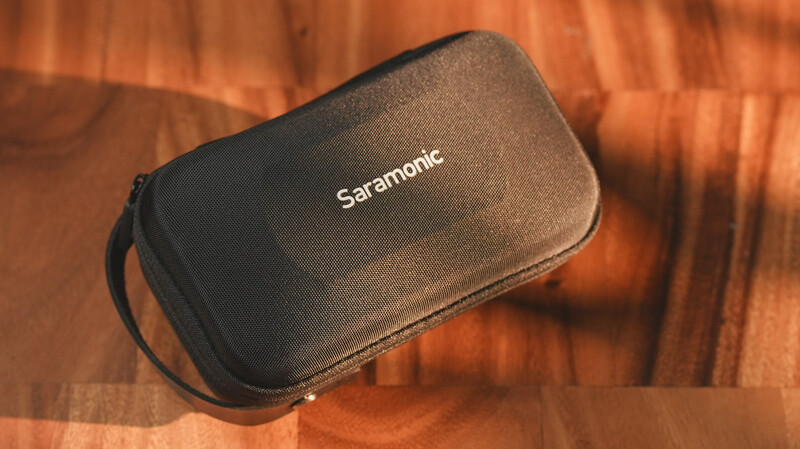 Saramonic protective carrying case with black neoprene exterior on warm wooden surface.