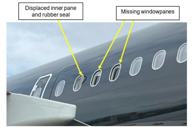 Aircraft fuselage showing damaged windows with displaced inner pane and missing windowpanes marked by yellow arrows.