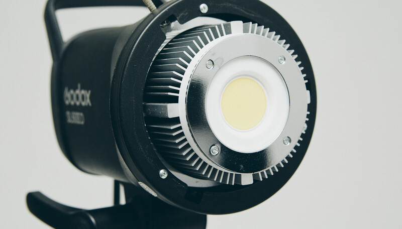 Godox SL60D LED light with ribbed heatsink and bright central lens element.