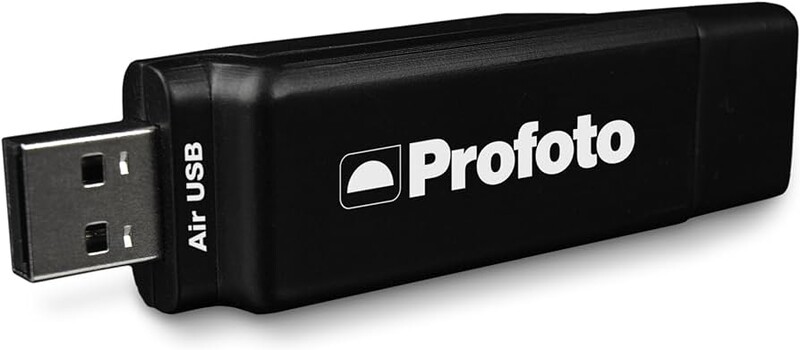 Profoto Air USB wireless transmitter with USB connector and branded black casing.